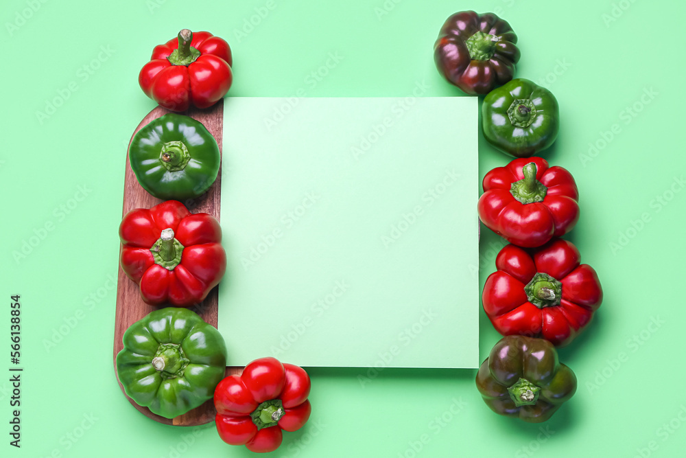 Composition with fresh bell peppers and blank sheet of paper on color background Composition with fresh bell peppers and blank sheet of paper on color background