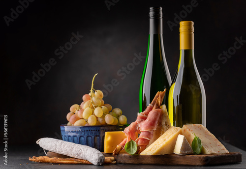 Antipasto board with various cheese and snacks