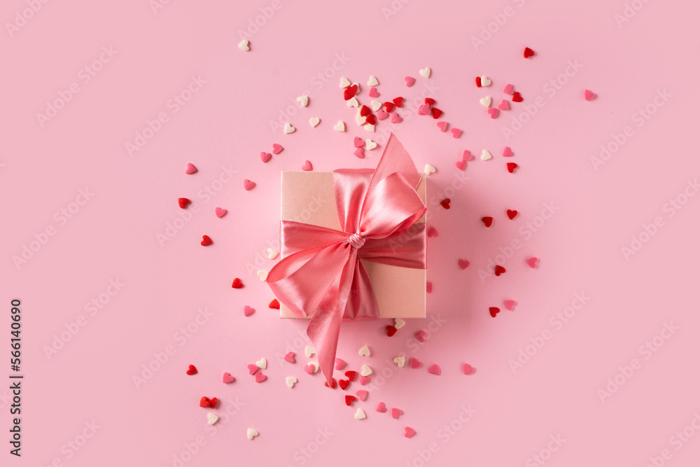 Pink gift box with bow on pink background Pink gift box with bow on pink background