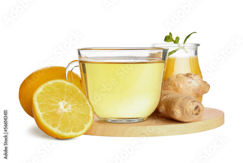 Board with ginger roots, lemon, mint, honey and cup of tea isolated on white background