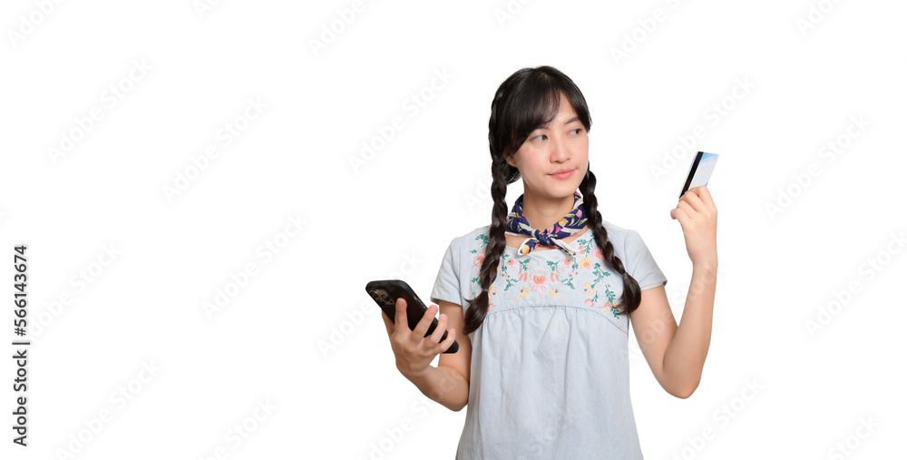 Portrait of beautiful happy young asian woman in denim dress holding credit card and smartphone on white background. studio shot Portrait of beautiful happy young asian woman in denim dress holding credit card and smartphone on white background. studio shot