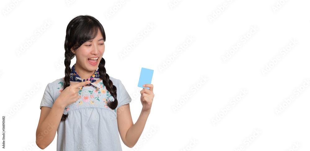 Portrait of beautiful happy young asian woman in denim dress holding credit card on white background Portrait of beautiful happy young asian woman in denim dress holding credit card on white background