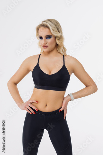 Sports model. Photo shoot in the studio on a white background. Athletic figure