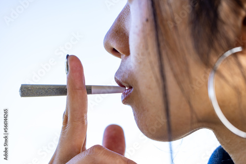 Close up of a female model smoking a joint photo