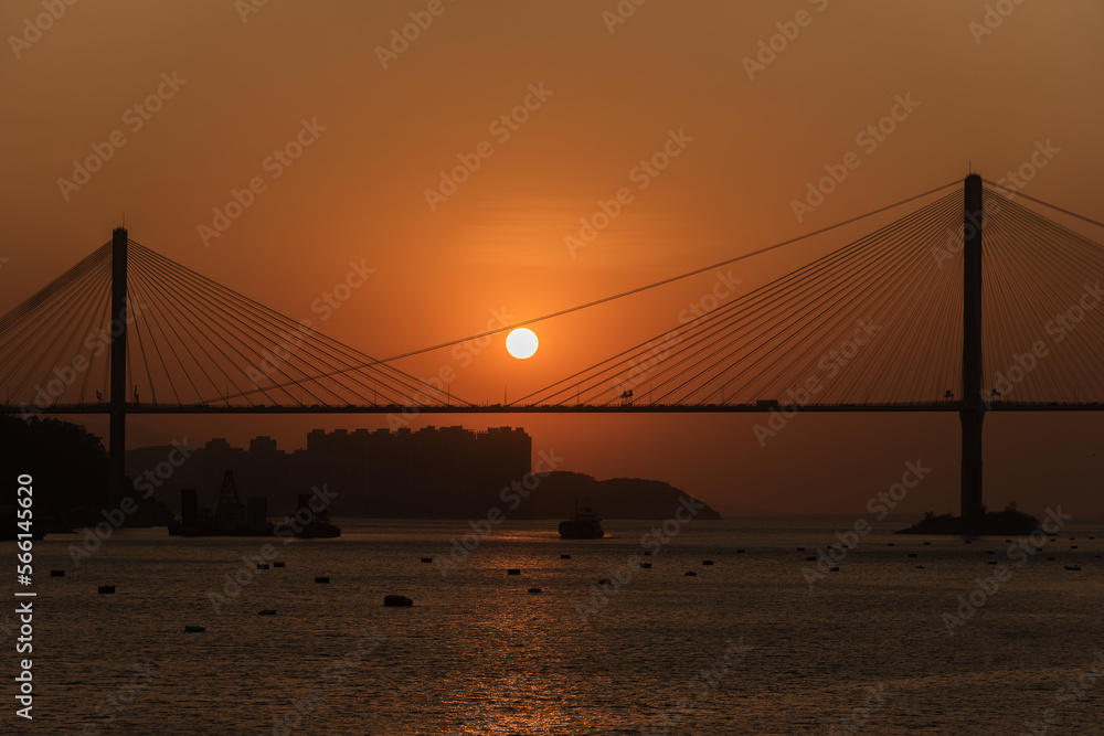 Sunset on suspension bridge in Hong Kong city Sunset on suspension bridge in Hong Kong city