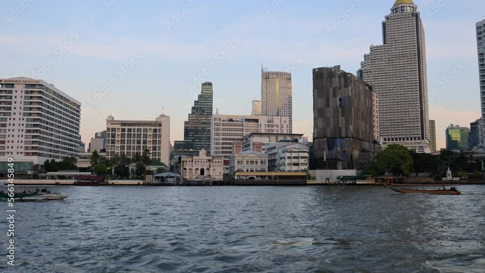 Bangkok, Thailand. December 29, 2022. Ferry boat moving on Chao Phraya river in Bangkok. Bangkok, Thailand. December 29, 2022. Ferry boat moving on Chao Phraya river in Bangkok.
