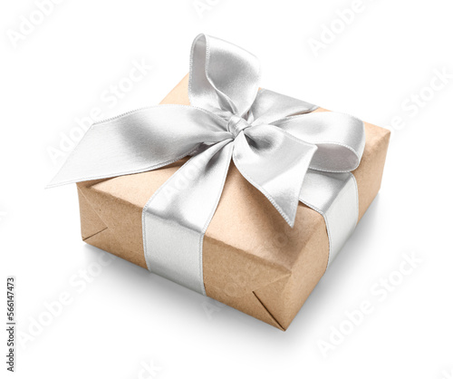 Gift box wrapped in craft paper with silk ribbon on white background