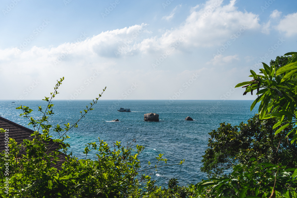 Viewpoint on Koh Tao, Thailand. Lookout at the sea with a diving boat driving by.
