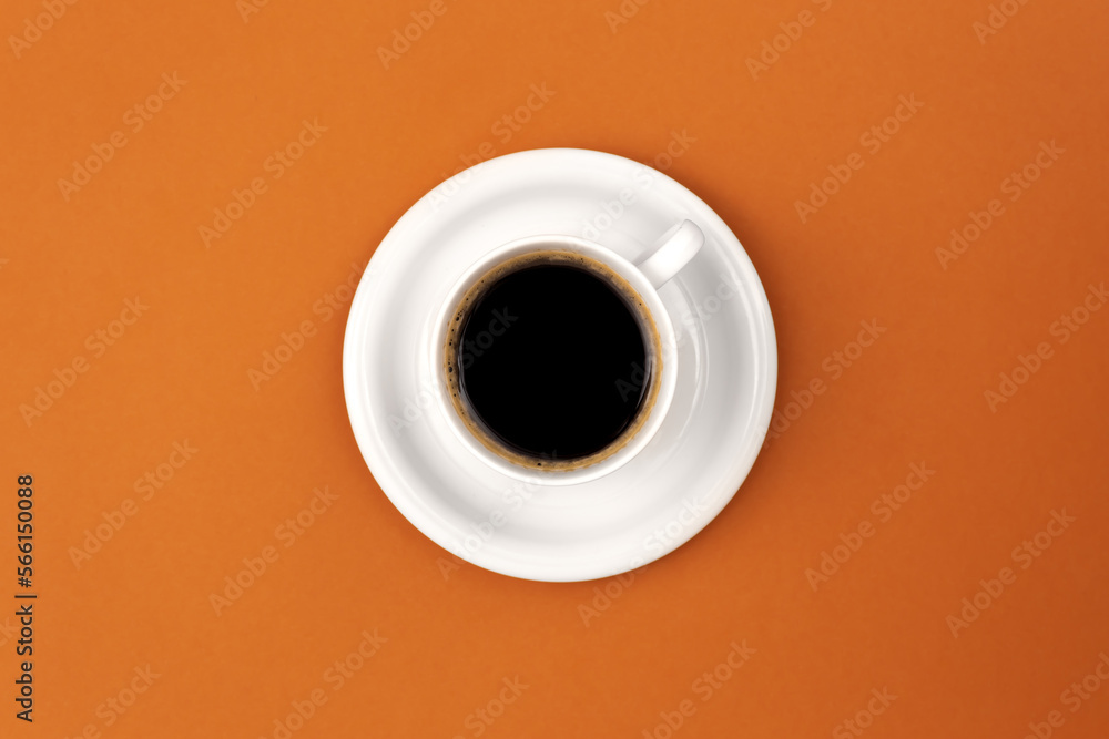 Coffee cup and saucer on brown background, flat lay. Coffee cup and saucer on brown background, flat lay.