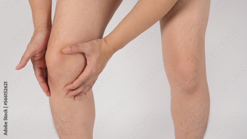 Asian Male knee pain and legs and barefoot is isolated on white background. Asian Male knee pain and legs and barefoot is isolated on white background.