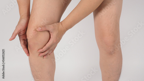 Asian Male knee pain and legs and barefoot is isolated on white background.