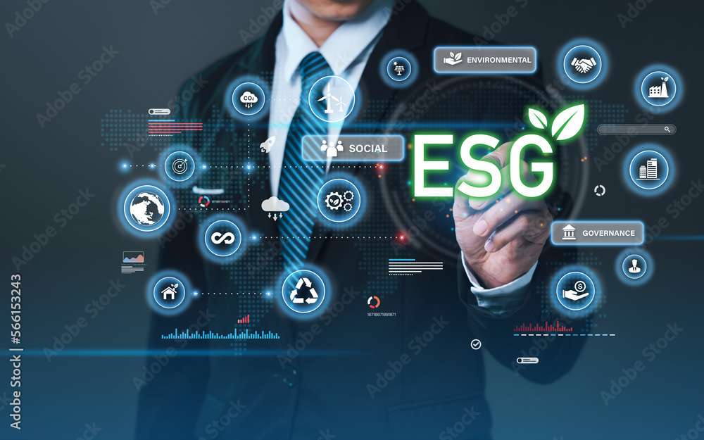 Businessman press the button icon ESG on the screen in environmental, social, and governance in sustainable and ethical business for target sustainable corporation development. Businessman press the button icon ESG on the screen in environmental, social, and governance in sustainable and ethical business for target sustainable corporation development.