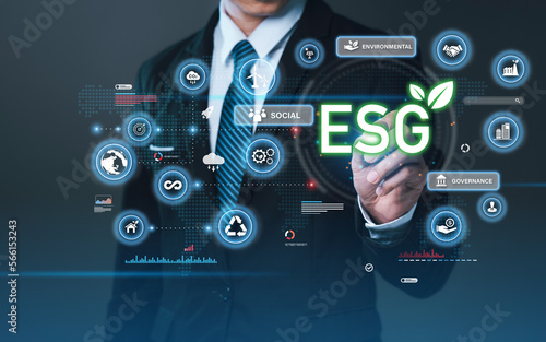 Businessman press the button icon ESG on the screen in environmental, social, and governance in sustainable and ethical business for target sustainable corporation development.