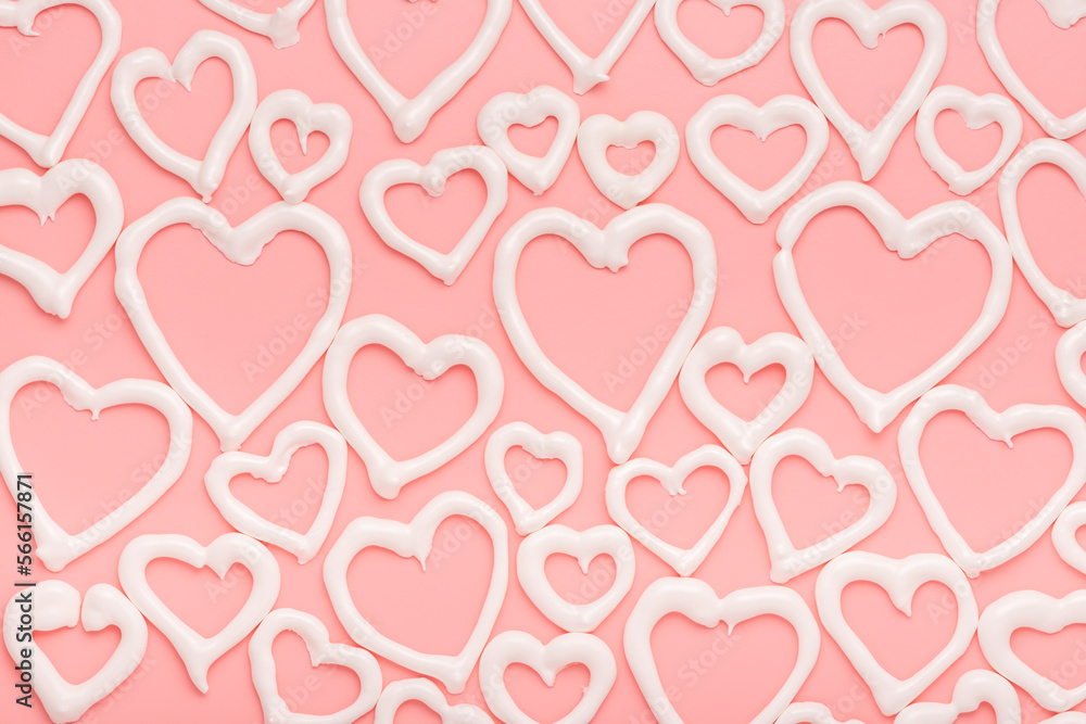 sweet meringue kiss cookies of heart shapes over pink background, concept of St. Valentines Day sweet meringue kiss cookies of heart shapes over pink background, concept of St. Valentines Day
