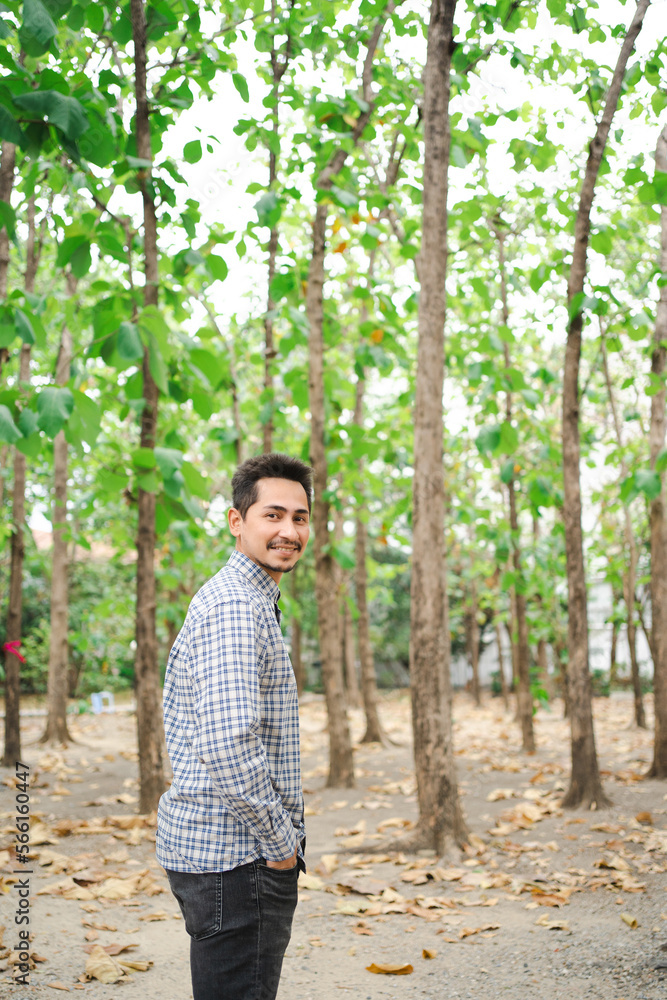 Man with beard and plaid shirt of aesthetic lumberjack in the middle of nature in portrait looking at camera. Man with beard and plaid shirt of aesthetic lumberjack in the middle of nature in portrait looking at camera.