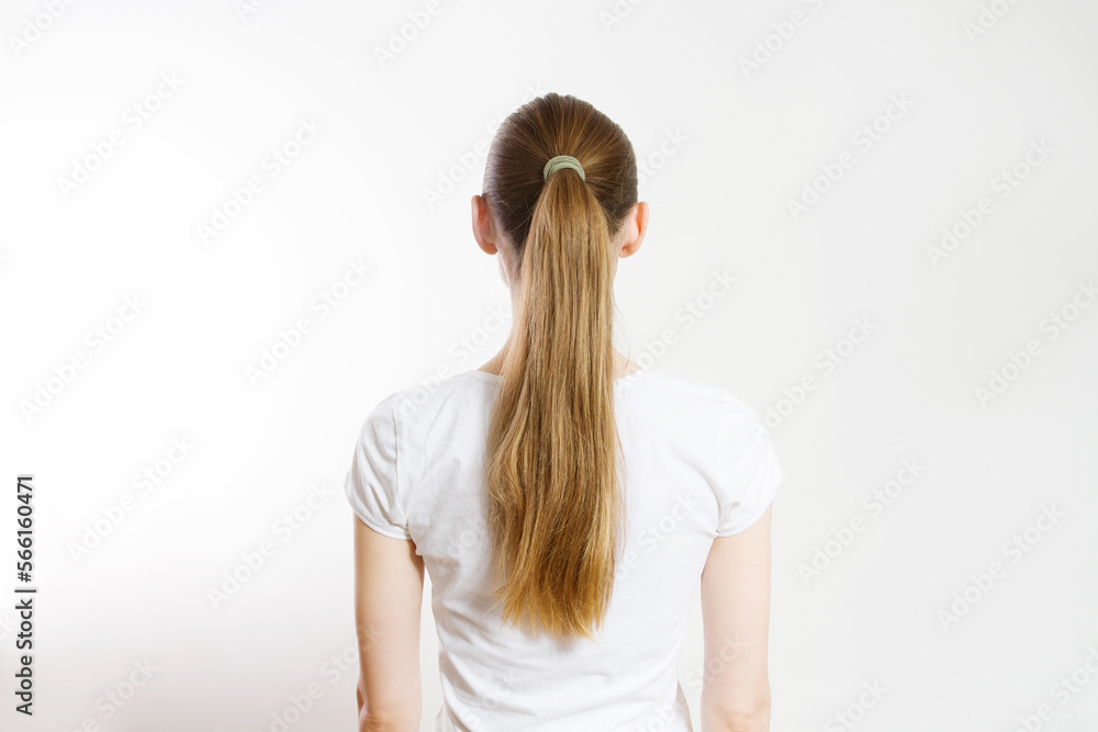 Closeup pony tail back view isolated on white background. Quick and easy Hair-styles for dirty long hair. A young woman with blond tied ponytail. Lazy home made hairstyles. Closeup pony tail back view isolated on white background. Quick and easy Hair-styles for dirty long hair. A young woman with blond tied ponytail. Lazy home made hairstyles.