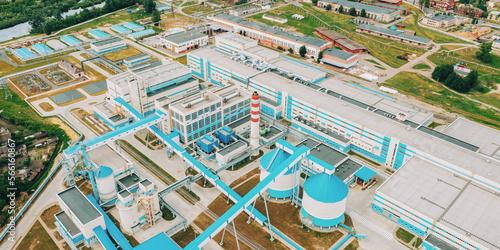 Aerial view of modern paper mill in summer sunny day. Bird's-eye view of paper factory. photo