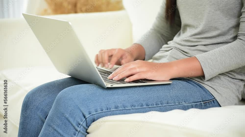 Happiness Asian Woman working from home using laptop online meeting in home office. Happy relax time asian business woman typing keyboard use notebook laptop Smiling, laughing at home office. Happiness Asian Woman working from home using laptop online meeting in home office. Happy relax time asian business woman typing keyboard use notebook laptop Smiling, laughing at home office.
