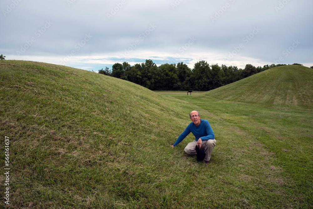Man examines prehistoric Native American burial mounds in Ohio
