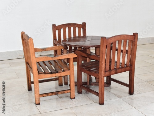 Round table and three chairs  on a white background