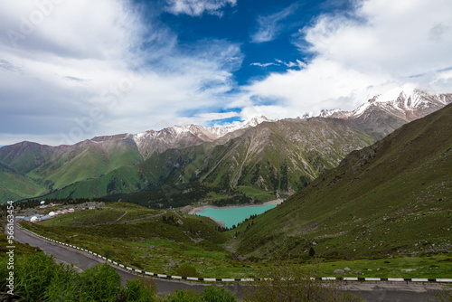 The most beautiful turquoise Big Almaty Lake with a view of the serpentine road and the observatory