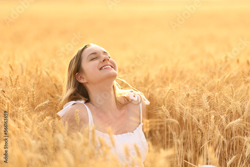 Happy woman breathing in a field