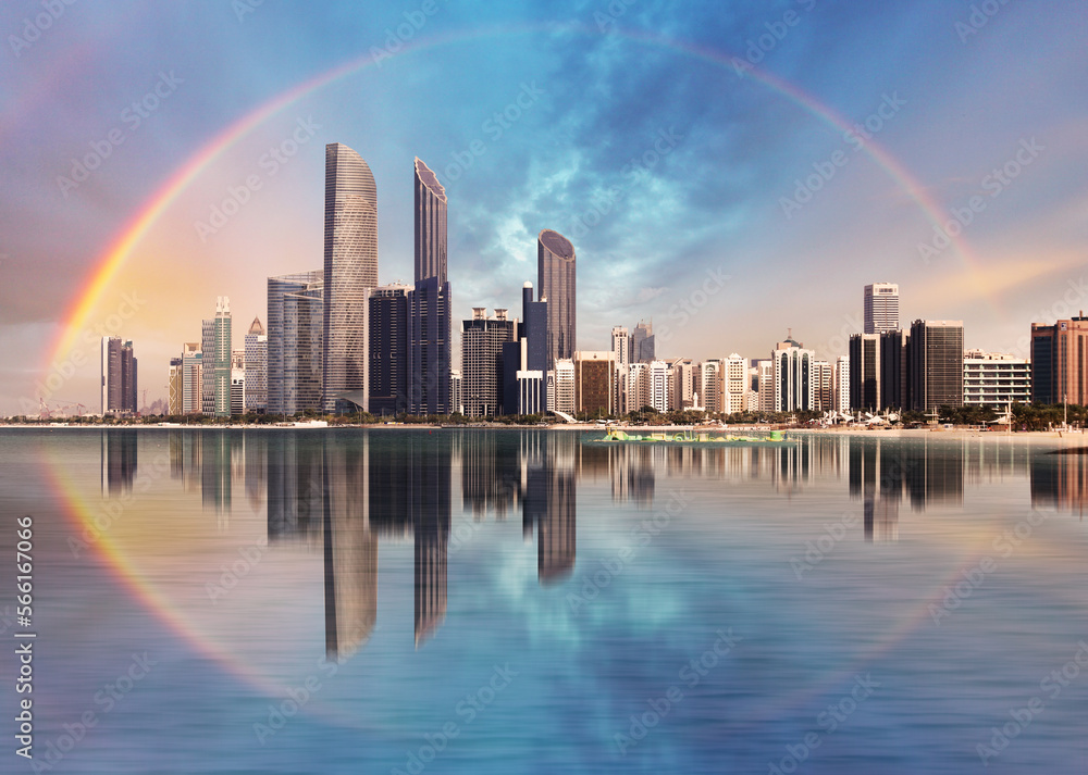 Rainbow over Abu Dhabi skyline with reflection in sea, United Arab Emirates - panorama - obrazy, fototapety, plakaty 