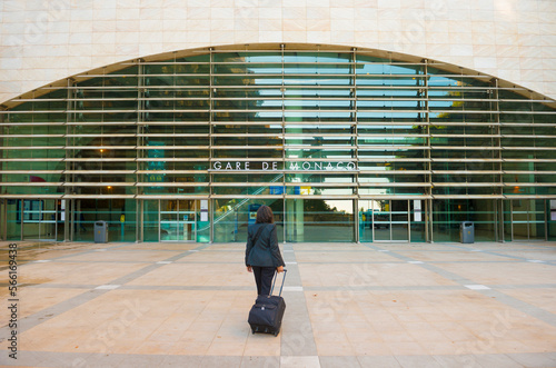 Elegant Woman with Her Suitcase in Front of Railroad Staion in Monte Carlo, Monaco.
