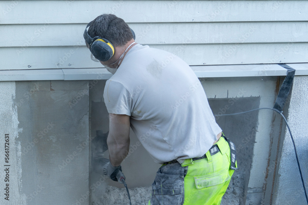Cutting concrete wall with angle grinder and diamond disk. Cutting concrete wall with angle grinder and diamond disk.