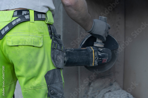 Cutting concrete wall with diamond blade.
