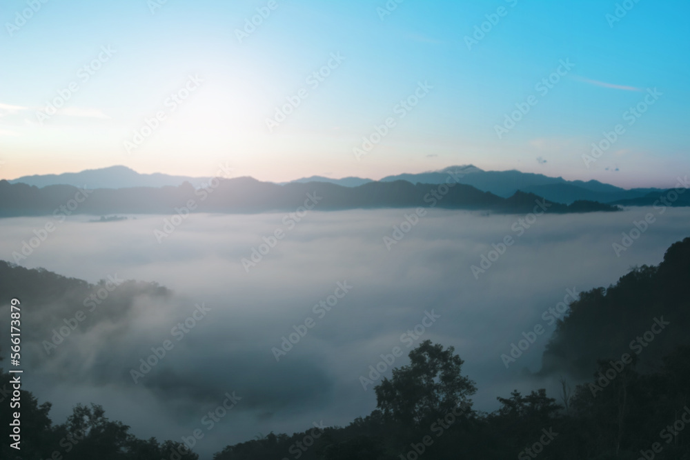 Natural background blurring warm colors and bright sun light. Sky sunny color orange light patterns plain abstract flare evening clouds blur. Natural background blurring warm colors and bright sun light. Sky sunny color orange light patterns plain abstract flare evening clouds blur.