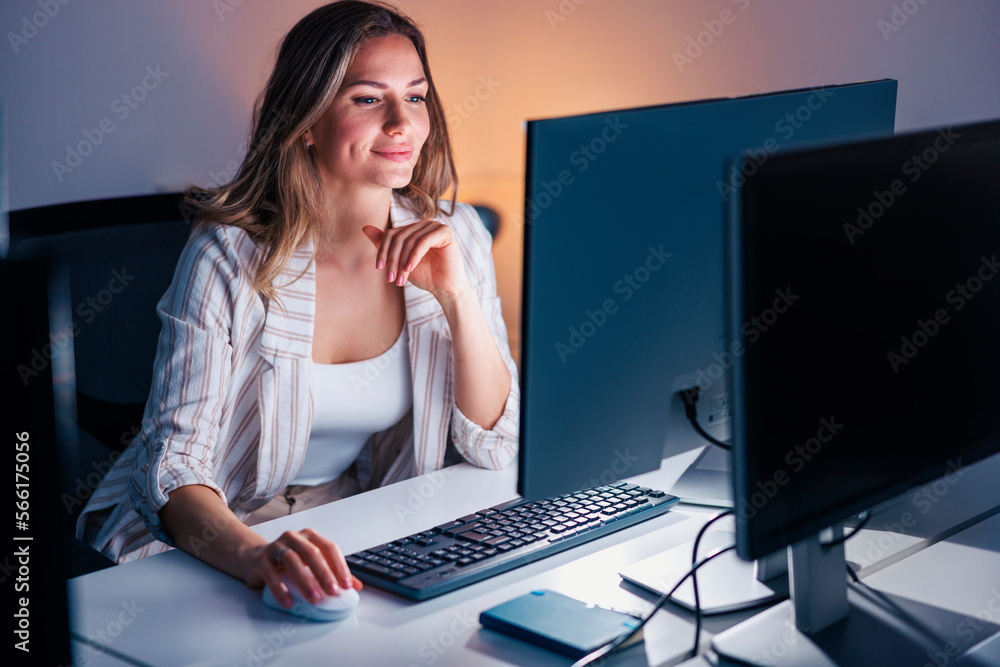 Woman working late in an office Woman working late in an office