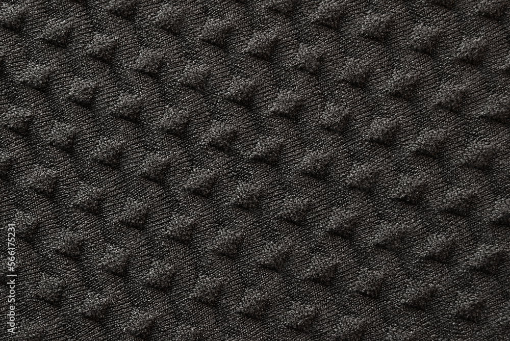 Black color tiled fabric texture as background Black color tiled fabric texture as background