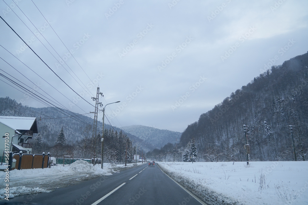 road. bridge over a valley in winter. the snow. low road traffic due to weather phenomena. road. bridge over a valley in winter. the snow. low road traffic due to weather phenomena.