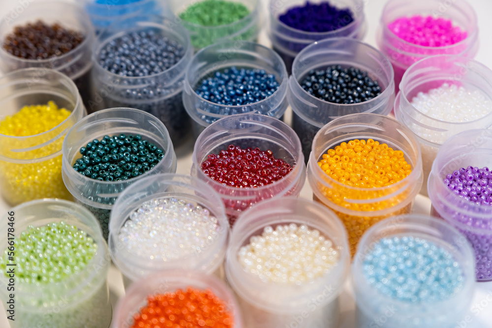 Items for beading - boxes with beads on the table. Development of creative abilities in children. view from above. - boxes with beads on the table. Development of creative abilities in children. 