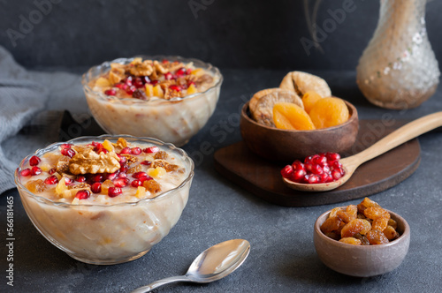 Traditional Turkish delicious mixed dessert, ashura (asure) with pomegranate seeds, walnut, apricot, Noah’s pudding