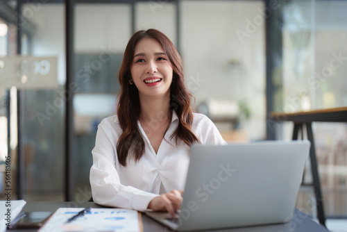 Beautiful Business woman working at home office and analyze financial report document. Accounting and Finance concept