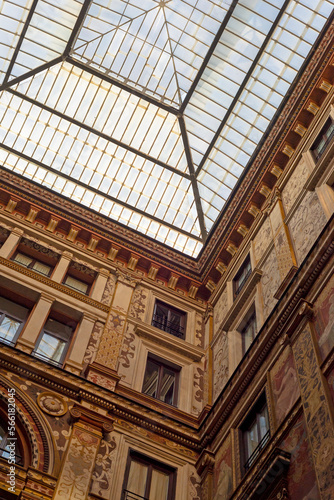 Obraz na płótnie Part of a building and a glass roof in Rome. Windows, walls, facades, ornamentation. w salonie