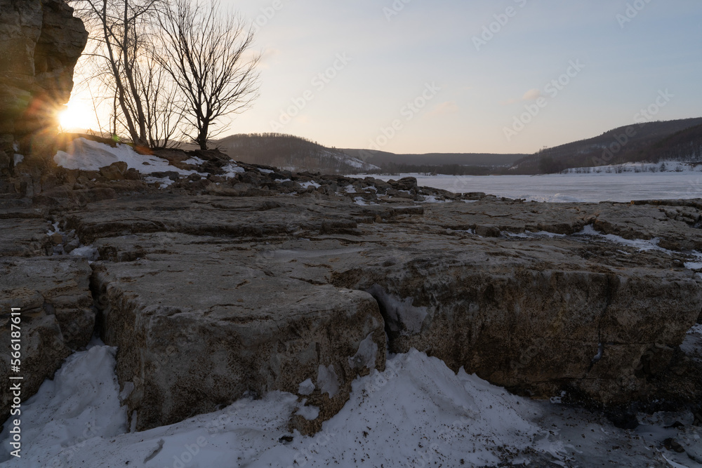 Winter sunset on the big river, hummocks in the rays of the sun. Winter sunset on the big river, hummocks in the rays of the sun.