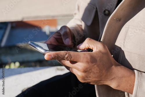 young man writing on his smartphone