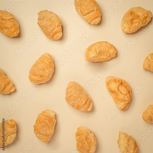 pattern of fresh bake gplden brown croissant for breakfast in bakery. minimal creative background composition. photo