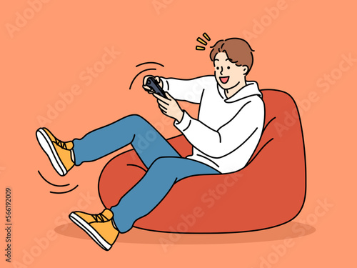 Boy relax at home playing video games