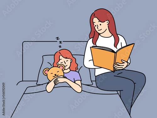 Loving mother read book to daughter in bed