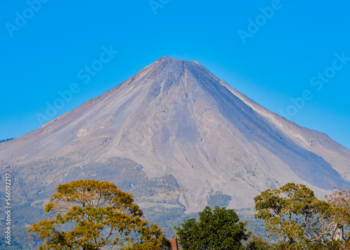 Road leading to the Colima volcano amidst a scenery