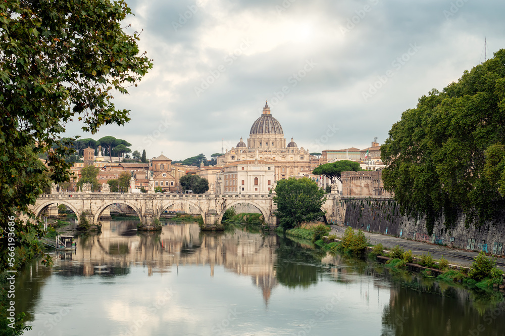 Beautiful morning view of Rome Skyline with the famous Vatican Saint Peter Basilica and Saint Angelo Bridge above Tiber River in Rome, Italy.