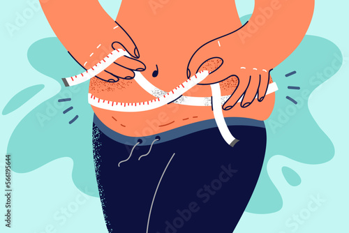 Overweight woman measure waist with tape