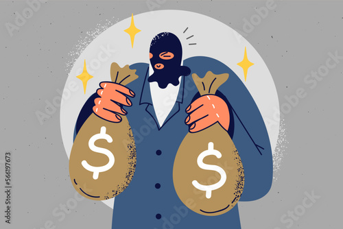Male robber hold bags with money 