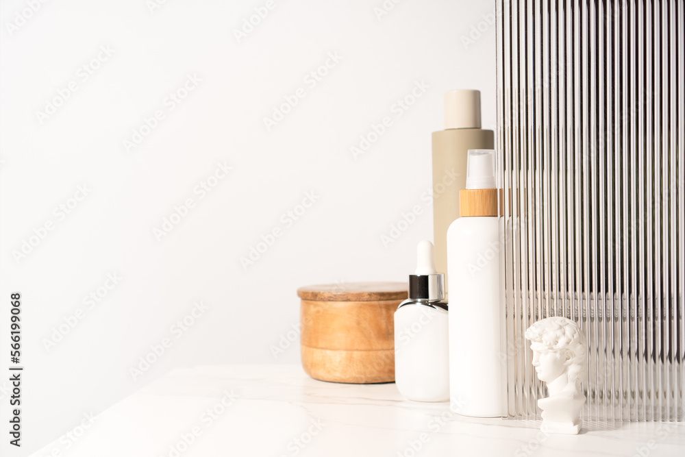 Naklejka premium Cosmetics products scene made with varierty of bottles on a shelf.