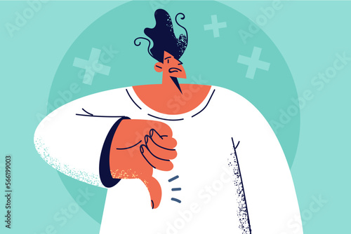Unhappy man show thumb down 