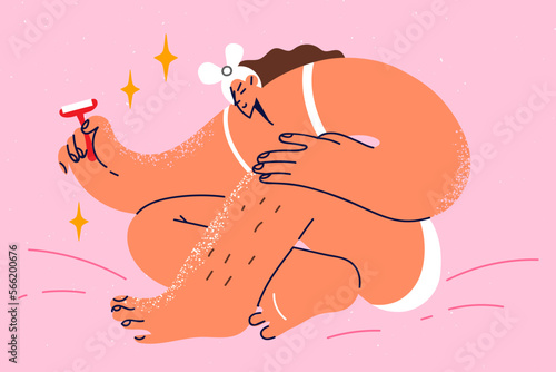 Woman shaving legs with razor